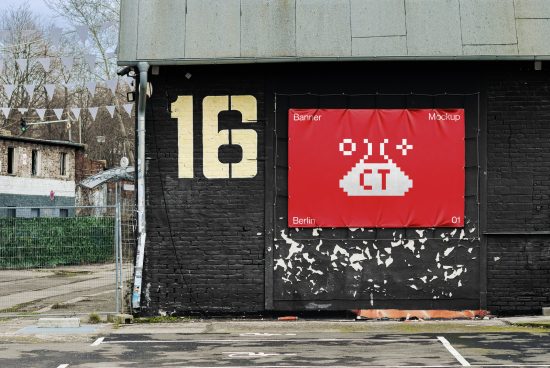 Urban street mockup with red pixel-art styled banner hanging on a black brick wall, numbered building 16, ideal for presenting designs.
